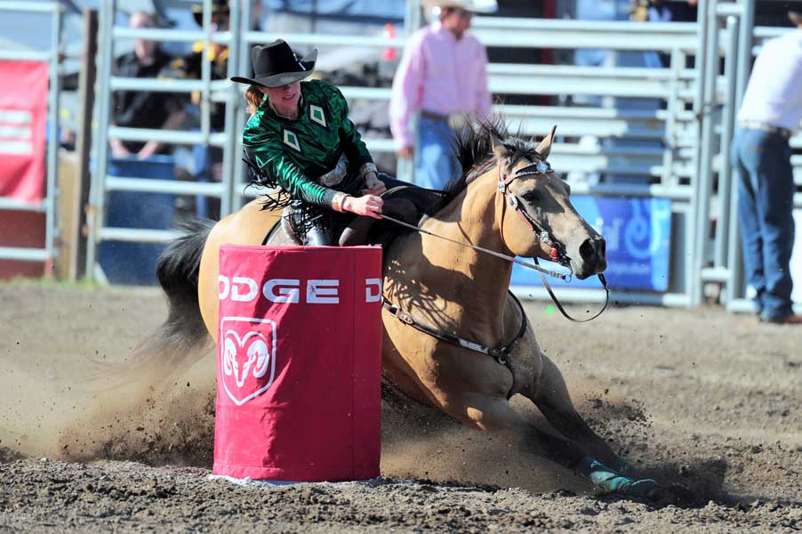 Barrel racer turning a barrel, High River, AB, 2010